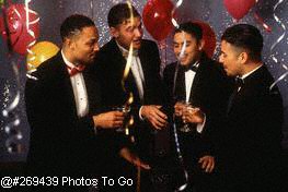 Four men toasting at party
