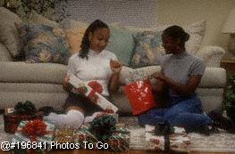 Sisters at home w/Christmas presents